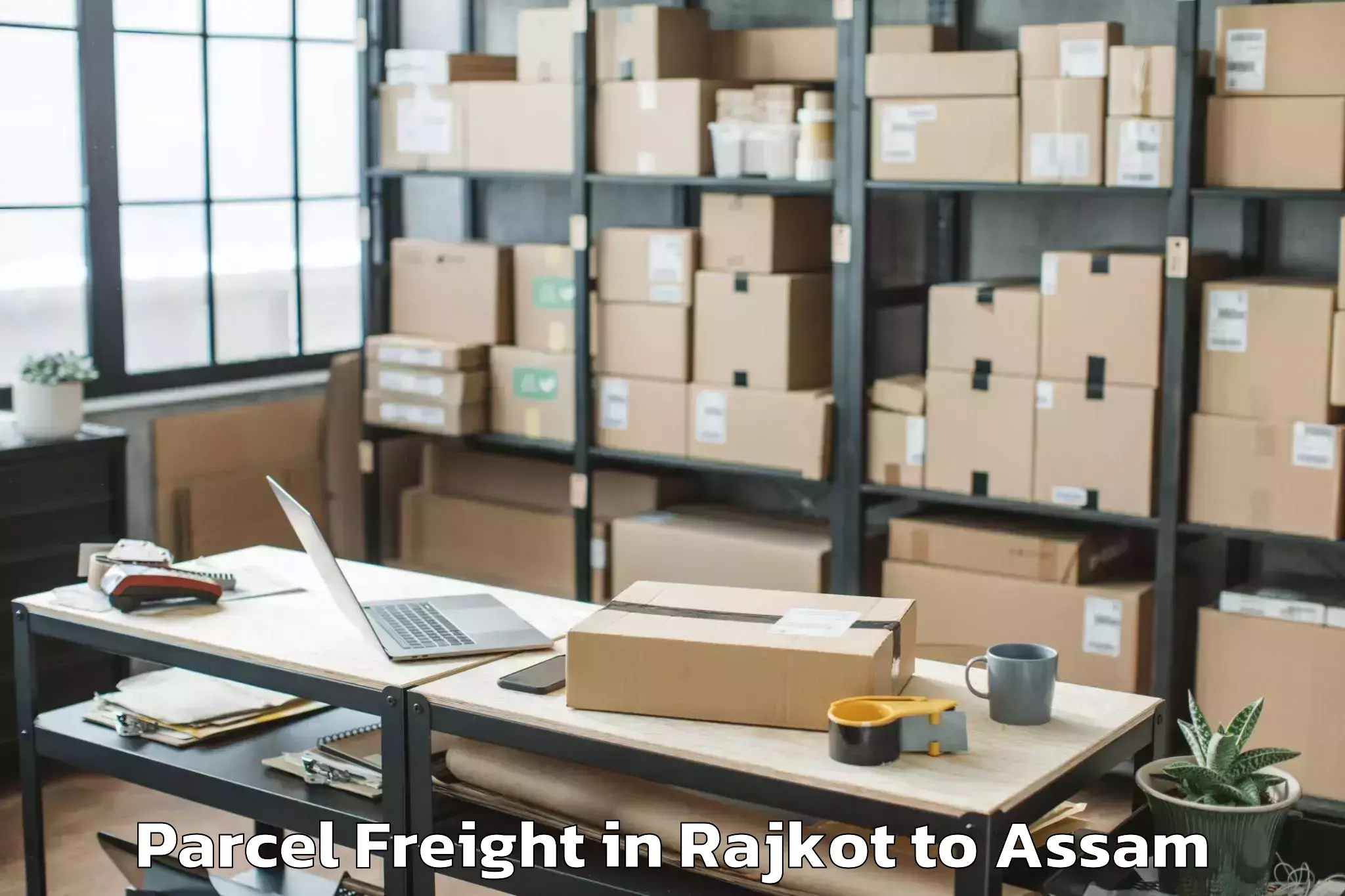 Easy Rajkot to Bokakhat Parcel Freight Booking